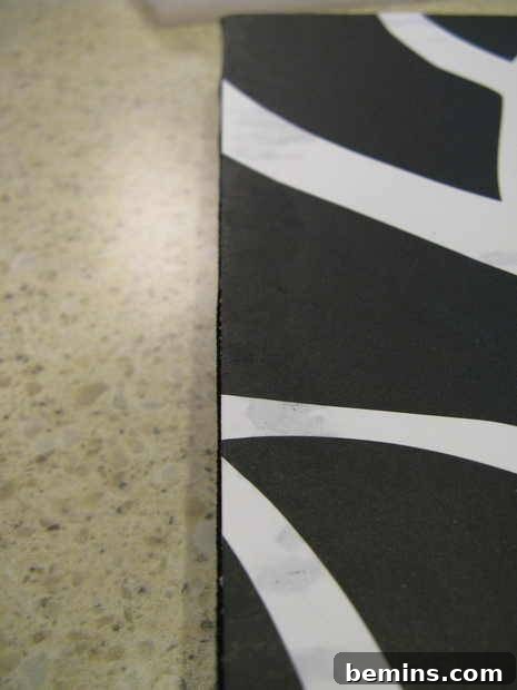 Creating Dimensional Wall Decor from Foam 7 A black and white material on a marble surface.