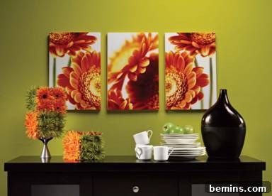 Creating Dimensional Wall Decor from Foam 9 A black shelf has colorful decorations, plates, mugs and there is a picture on the wall.