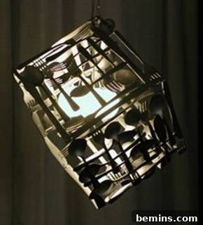 Artistic lighting fixture constructed from spoons and forks, displaying a unique and creative design.