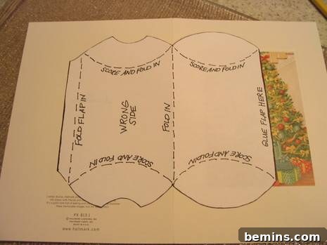 Directions for folding a pop-up Christmas card, showing the template in position.