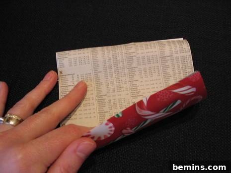 Rolling up a piece of paper.