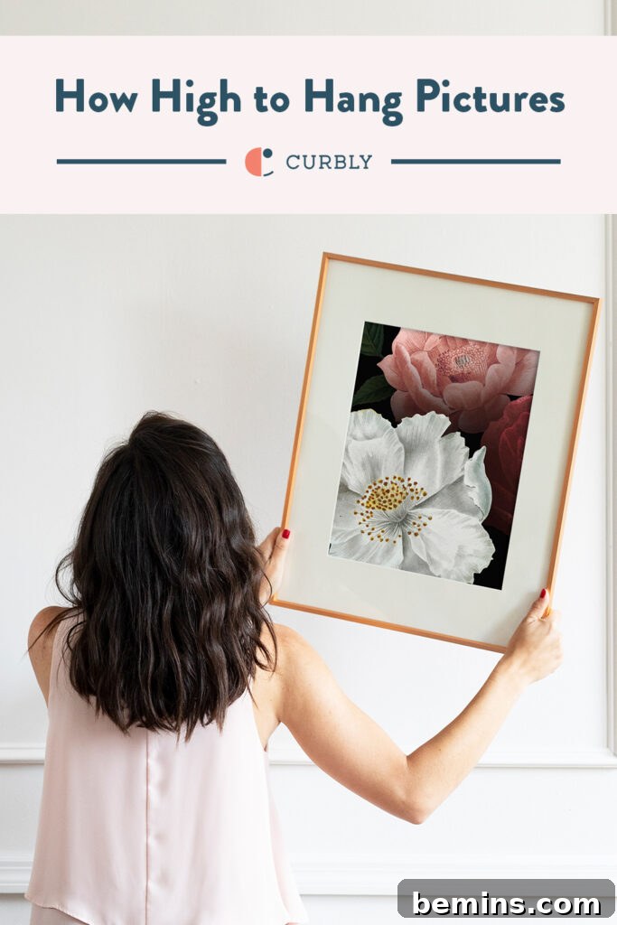 how high to hang pictures