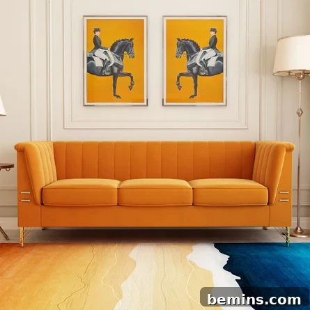 colorful artwork hanging above an orange couch