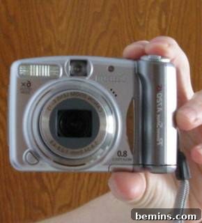 How to Craft a Killer DIY Tutorial 3 Close-up of hand holding a camera during a DIY project.