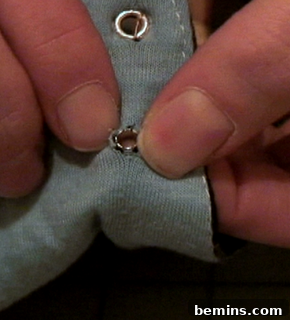 A corset hole being made