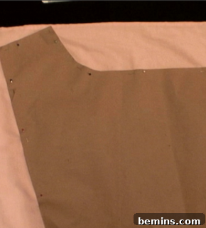 Boxer pattern pinned to a pillowcase ready for cutting.