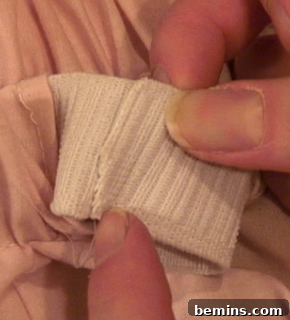 Sewing the elastic ends together.