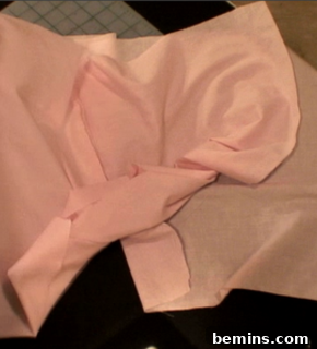 Sewing the sides of the boxers together.