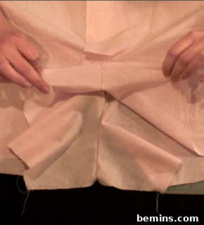 Folding fabric to attach the crotch area.