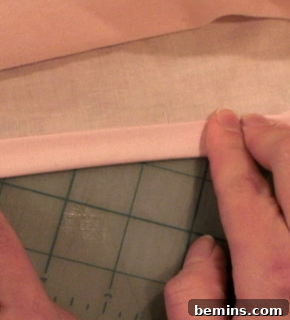 Hemming the leg holes of the boxers.