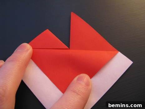 Folding a piece of red paper