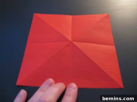 Person demonstrating how to make origami