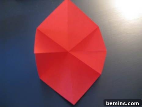 Red colored paper is in the floor