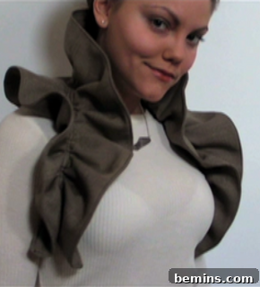 Creating a Statement Ruffled Vest: A Couture DIY 11 Woman wearing a white dress and looking forward.
