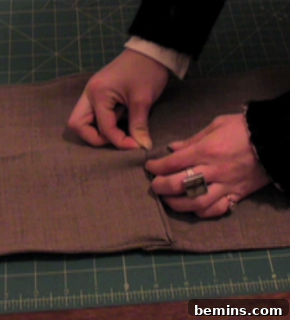 Sewing the pleats in place.