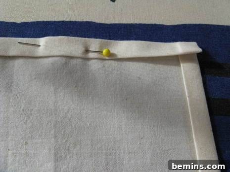 Pinning the folded edges in place