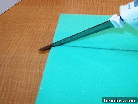 Applying adhesive to the foam before attaching it to the coffee table.