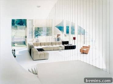 Interior view of the UN Studio Villa showing the floor-to-ceiling windows and the connection to the landscape