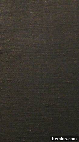 Unlock Pottery Barn Bronze Paint At Home 4 A large area painted to show a sample of black paint.