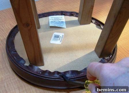 Refurbishing Round Bar Stools: A DIY Upholstery Guide 4 Removing old staples from the bar stool
