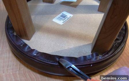 Refurbishing Round Bar Stools: A DIY Upholstery Guide 5 Removing old fabric from the bar stool