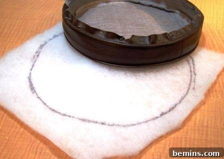 Refurbishing Round Bar Stools: A DIY Upholstery Guide 9 Tracing the old fabric cover onto dacron batting
