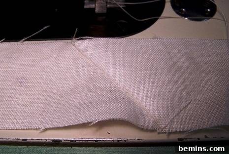 Fabric strips joined with a diagonal seam, showing the trimmed excess fabric
