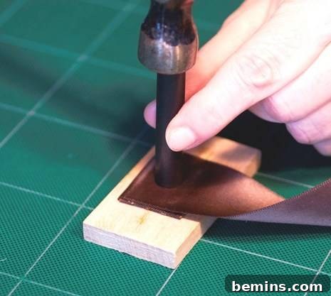 Using the hole punch tool to create an indentation