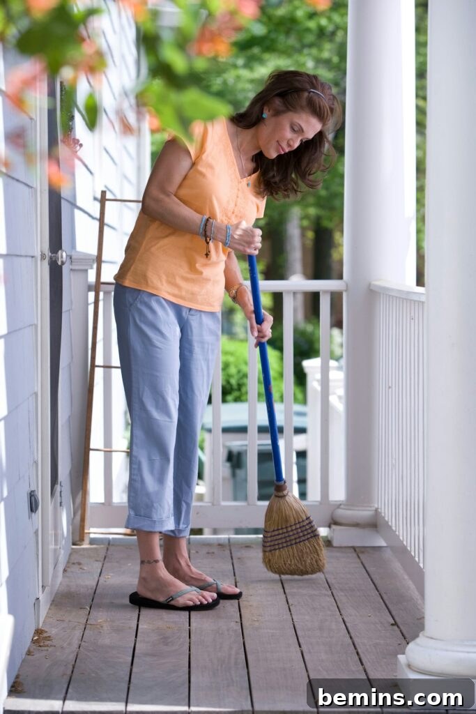 The Ultimate Spring Refresh: Your Comprehensive Cleaning Guide 2 Woman Sweeping Porch