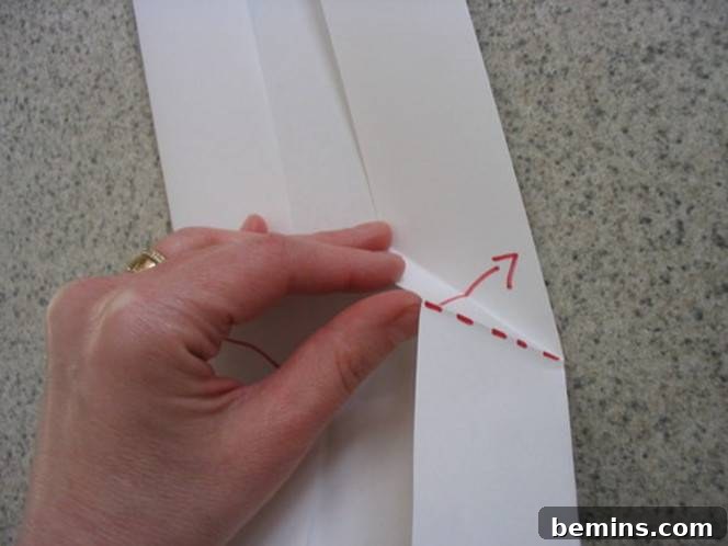 Horizontal creases are identified on the paper.