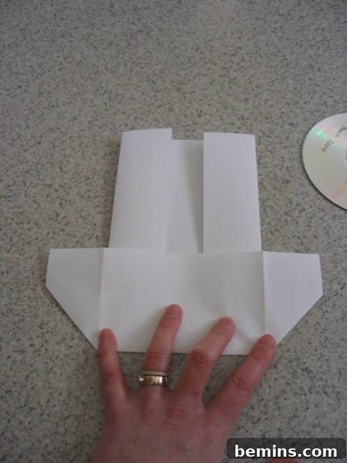 The box-shaped flap is being folded down.