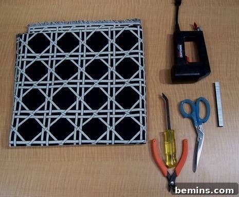 Tools and materials needed for reupholstering a stool