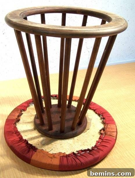 Removing old staples from the stool frame