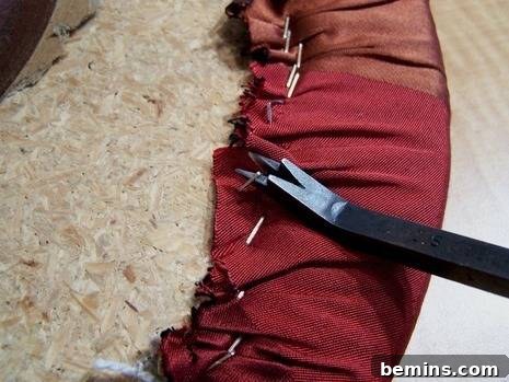 Close-up of removing staples from the stool