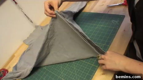 From Turtleneck to Trendy: DIY Shrug Transformation 3 Cut off the bottom section