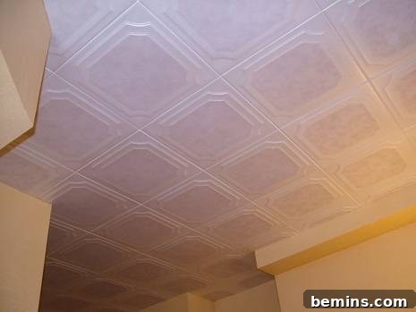 Finished basement ceiling with polystyrene tiles