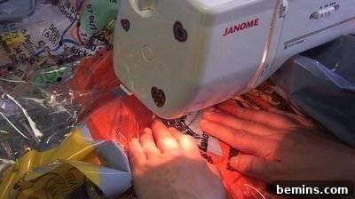 DIY Rain Gear: Transforming a Shower Curtain into a Poncho 17 Sewing machine close-up