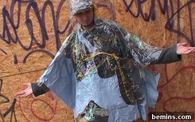 DIY Rain Gear: Transforming a Shower Curtain into a Poncho 18 Man wearing a shower curtain poncho