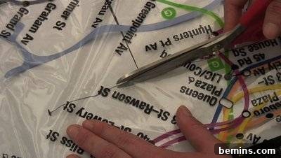 DIY Rain Gear: Transforming a Shower Curtain into a Poncho 8 Cutting head hole on shower curtain