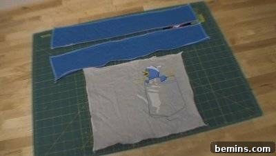 A green squares of fabric which has several smaller parts sitting on top of it. Sewing a Flap.