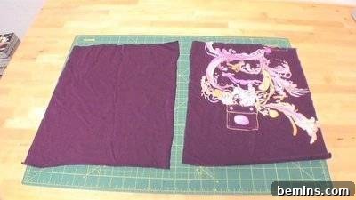 Purple and white material on a gridded material. Stuffing the Pillow.