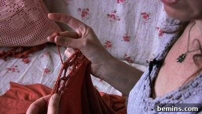 Woman Holding Errant Cord on Red Shirt