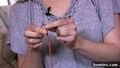 Woman Holding Knitting Needle with Yarn