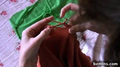 Person Knitting Orange Material