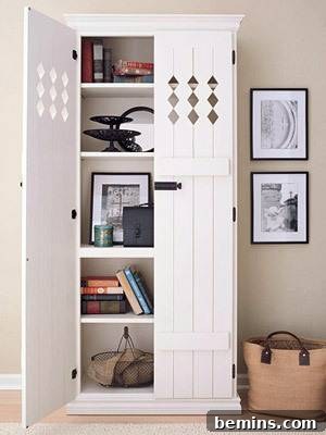 Shabby chic bookcase makeover with damask wallpaper and skirt
