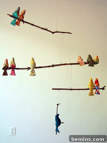 Handmade fabric birds adorning a wall, showcasing intricate design and craftsmanship.