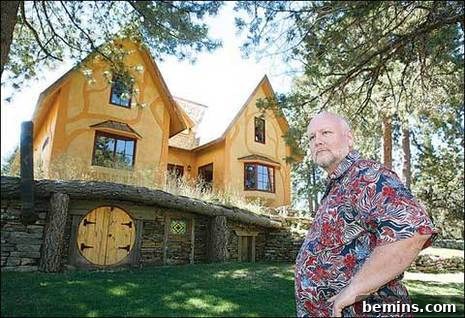 A charming hobbit house with a small, round door.