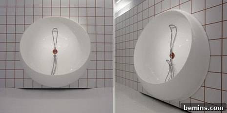 Revolving Relaxation 2 A white dome-shaped interior of the innovative bath unit, featuring a wire object and intricate detailing, highlighting its artistic and functional design.