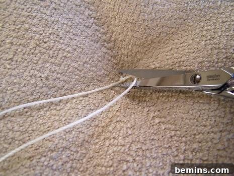 DIY Mod Upholstery: Faux Tufting Techniques 11 Trimming the excess twine
