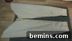 A large pair of pants laid out on the ground.